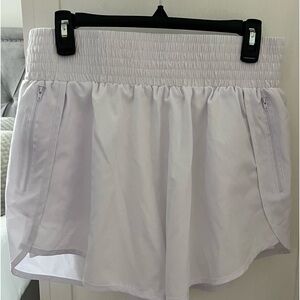 Size Large white running shorts.